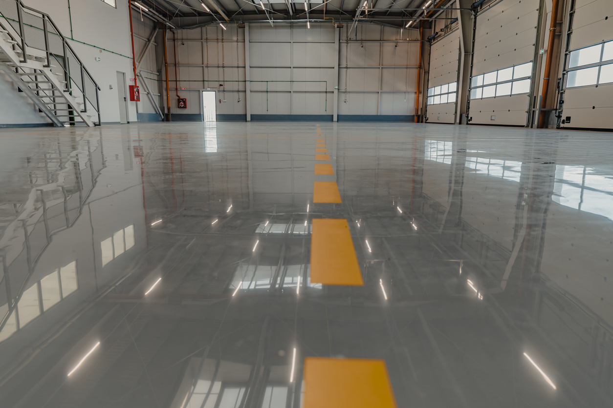 Epoxy and waxed flooring with colorful signage in car service